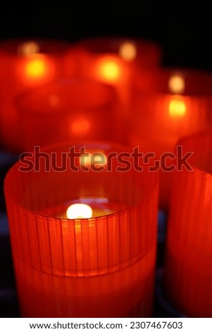 Candles lit in red plastic cups moment of praise and worship.