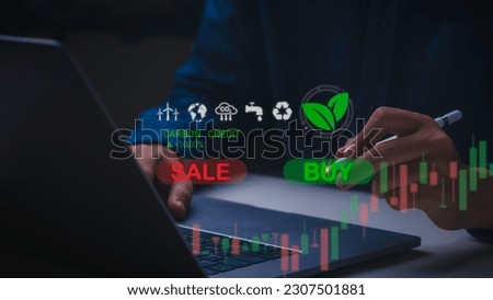Businessman uses technology to exchange carbon credits on virtual screen with net zero emissions, clean technology, renewable energy. Royalty-Free Stock Photo #2307501881