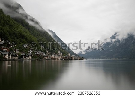Long exposure shot of Hallstatt in Austria across the lake.