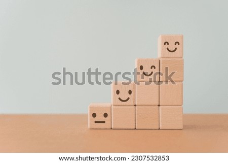 For positive thinking, added value, benefits, additional, personal development, growth mindset, positive thinking, opportunities,  mental heath concept. emoticon face on stack of wooden cube blocks Royalty-Free Stock Photo #2307532853