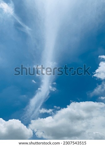 It's very nice and hot at noon, Cirrus clouds are fluffy white feathers that shoot straight into the sky with a base of clouds. Cirrocumulus forms beautiful waves in Bangkok, Thailand.