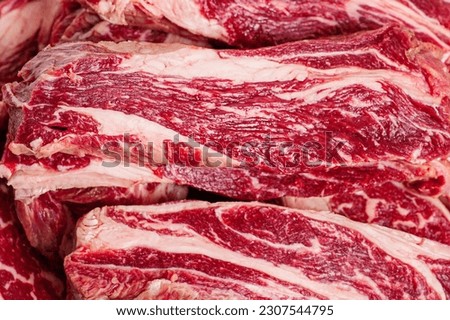 Marbled beef steaks as a background close-up. Cooking. Fresh meat. Royalty-Free Stock Photo #2307544795