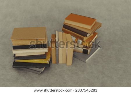 pile of books on a wooden background. education concept.