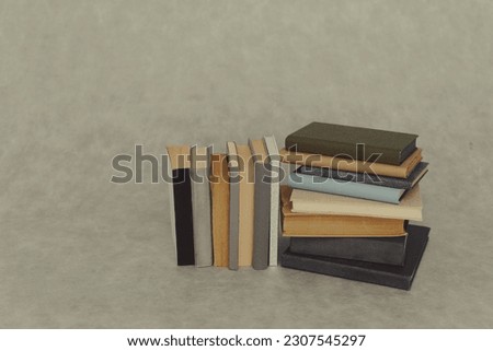 pile of books on a wooden background. education concept.