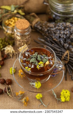 Herbal tea with medicinal herbs and flowers. Selective focus. Drink. Royalty-Free Stock Photo #2307545347