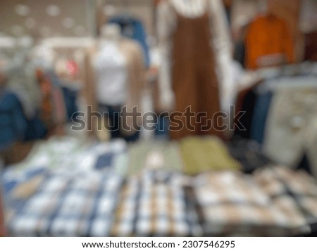 Defocused Abstract Background display up of women in departement store inside modern Shopping Mall or Shopping Center. 