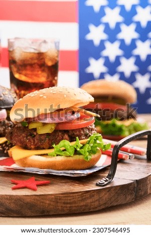 4th of July American Independence Day traditional picnic food. American Burger and cocktail, American flags and symbols of USA Patriotic picnic holiday on white wooden background. Top view