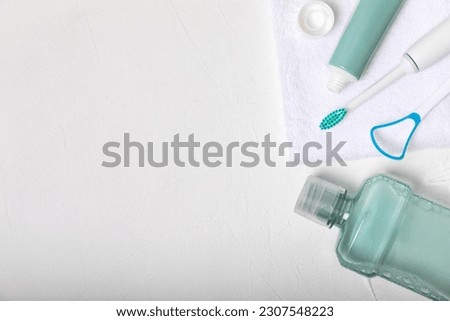 Bathroom with sonic electric toothbrush, toothpaste, mouthwash, dental floss and tongue cleaner . Oral hygiene. Dental care.Dentistry concept.Place for text.Place for copy.MOCKUP