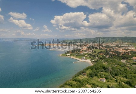 Aerial view of coastal town Royalty-Free Stock Photo #2307564285