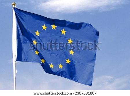 EU flag on cloudy sky. waving in the sky