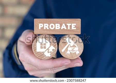 Lawyer holding wooden blocks and sees text: PROBATE. Concept of Legal Legacy. Probate Wealth House Estate. Inheritance of property by court decision. Royalty-Free Stock Photo #2307588247