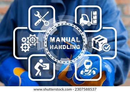 Worker or engineer using virtual touch screen sees inspiration: MANUAL HANDLING. Industrial concept of manual handling. Right and Wrong Manual Handling and Lifting of Heavy Goods. Royalty-Free Stock Photo #2307588537