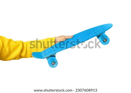 hand holding blue skate board isolated on white background