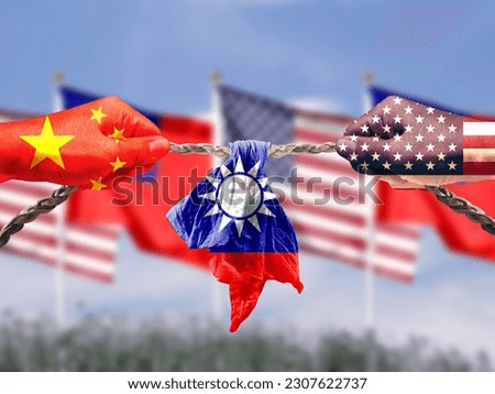United States and China flags combined fist together. Taiwan flag in tug of war. Describe the concept of U.S.-China competition and the importance of Taiwan semiconductors