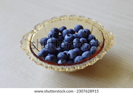 The northern highbush blueberry (Vaccinium corymbosum) in a bowl Royalty-Free Stock Photo #2307628915