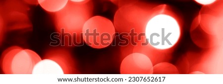 Blurred lights red background, banner texture. Abstract bokeh with soft light header. Wide screen wallpaper. Panoramic web banner with copy space for design