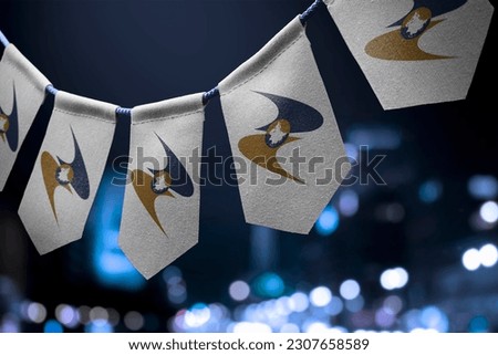 A garland of Eurasian Economic Union national flags on an abstract blurred background. Royalty-Free Stock Photo #2307658589