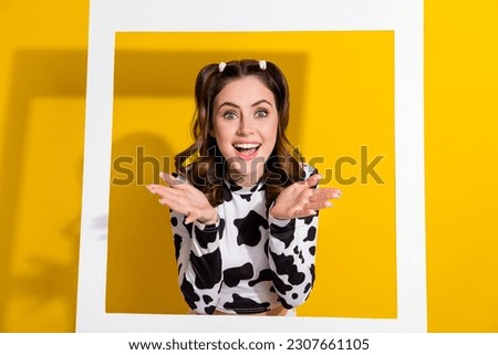 Photo of surprised shocked photographing in photozone on cow theme farm festival isolated shine color background