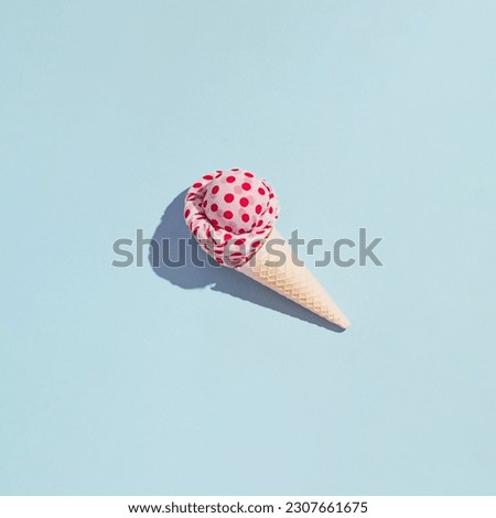 Minimal creative summer fashion trends concept, exotic fruit ice cream idea. Pastel blue background.