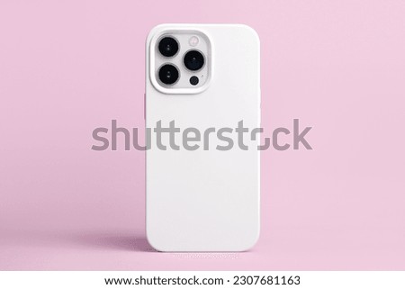 iPhone 14 pro max starlight in white case back view, phone cover mockup isolated on pink background Royalty-Free Stock Photo #2307681163