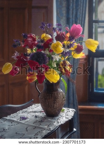 Still life with spring flowers in vase on table