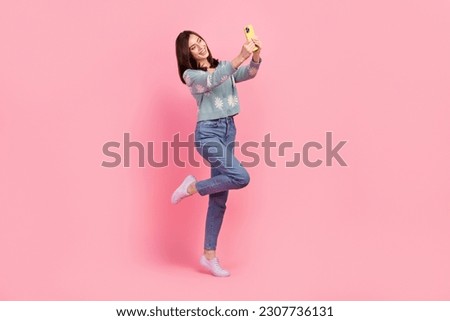 Full length photo of dreamy sweet lady wear turquoise clothes recording video vlog modern device isolated pink color background