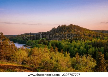Idhult nature reserve in Sweden with forests and mountains Royalty-Free Stock Photo #2307757707