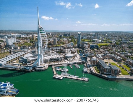The drone aerial view of Spinnaker Tower and Portsmouth Harbour. Portsmouth is a port city and unitary authority in Hampshire, England. Royalty-Free Stock Photo #2307761745