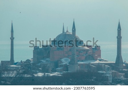 Hagia Sophia mosque and Istanbul view under snowfall in winter.