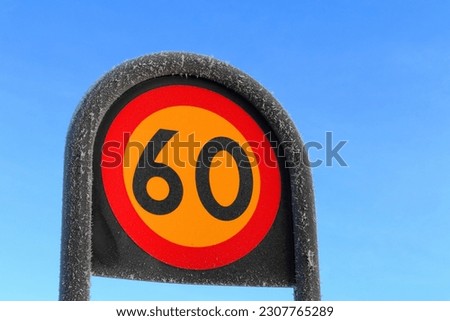 Swedish road sign. Maximum travel speed for 60 kilometer per hour. Close up and isolated. Sweden 2022.