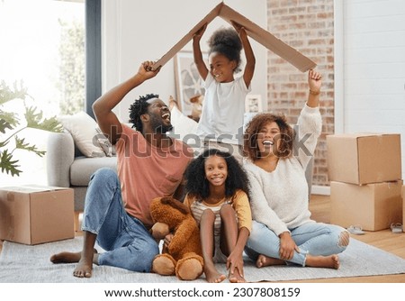Black family, floor and cardboard roof in home living room with game, laughing and bond with love. Father, mother and daughter with play, relax of box for sign of security in family house with smile