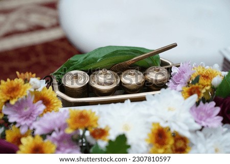 "Tepak sirih" is a traditional Malay term that refers to a decorative tray for presenting betel leaves, areca nuts, and other items for a wedding or engagement ceremony. Royalty-Free Stock Photo #2307810597