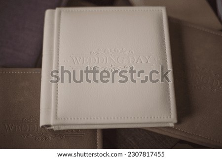 Wedding photobooks in brown leather binding. Wedding photo book, album family album. Photo books with embossing and a cover of genuine leather. Services of a professional photographer and designer. 