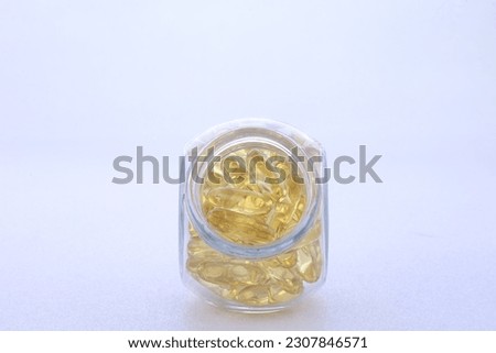 Close up of the oil capsule (soft gel) suitable for the presentation of food supplements: fish oil, omega 3, omega 6, omega 9, vitamin A, vitamin D, vitamin D3, vitamin E, night primrose oil, oil of b