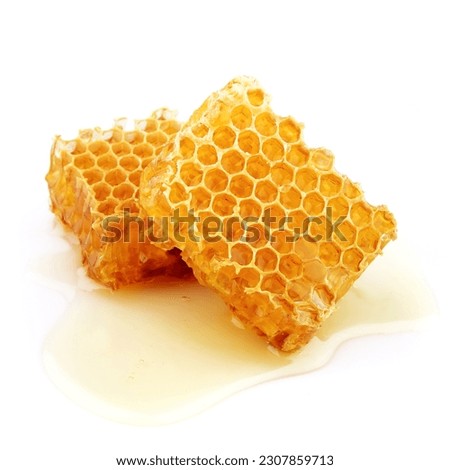Honeycomb close up on the white background Royalty-Free Stock Photo #2307859713