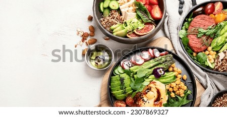 Healthy vegetarian and vegan  salads and Buddha Bowls with vitamins, antioxidants, protein on light  background. Top view, copy space
