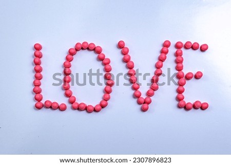 Write love words to your loved ones. Create letters with pink beads on white paper for someone. Mother day 