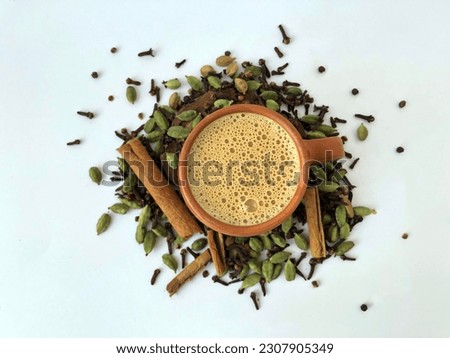 image of Desi kullad tea with ingredients. editable background