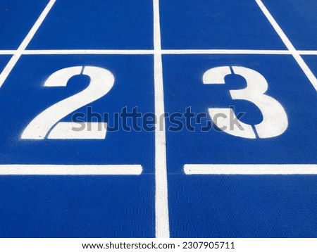 Stadium runway or athlete's track start number (2) (3). Tracks are rubber man-made tracks used in athletics. Royalty-Free Stock Photo #2307905711