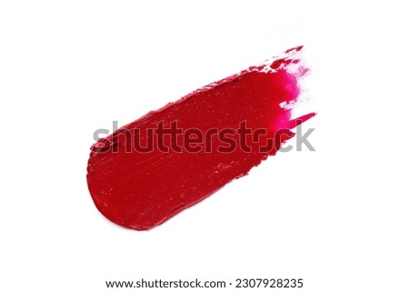 Red lipstick swatch isolated on white background. Brush stroke of lipstick or wet eye shadow for design. Royalty-Free Stock Photo #2307928235