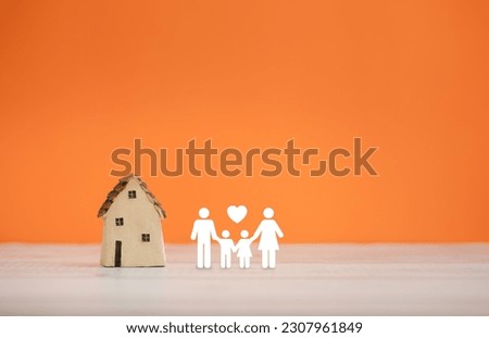 home sweet home, home model with family icon on orange color background Royalty-Free Stock Photo #2307961849