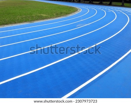 Stadium track or track for athletes. Tracks are rubber man-made tracks used in athletics. Royalty-Free Stock Photo #2307973723