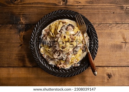 Carbonara-like pasta with porcini and bacon