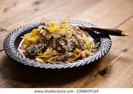 Carbonara-like pasta with porcini and bacon