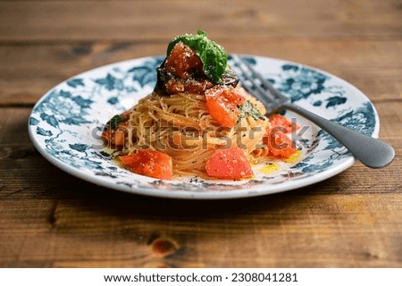 Cold pasta with tomato and basil