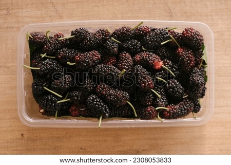 ripe mulberry fruits close-up, top view