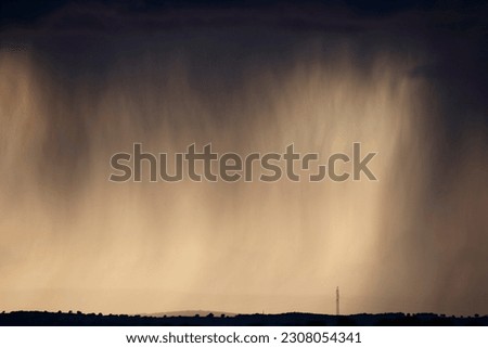 photography of storm clouds rain discharge made with telephoto lens