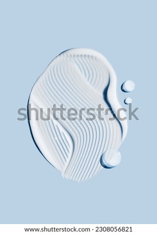 cosmetic smears of creamy texture on a blue background
