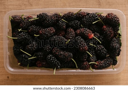 ripe mulberry fruits close-up, top view