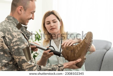 Portrait of a disabled US military officer holding prosthesis leg 